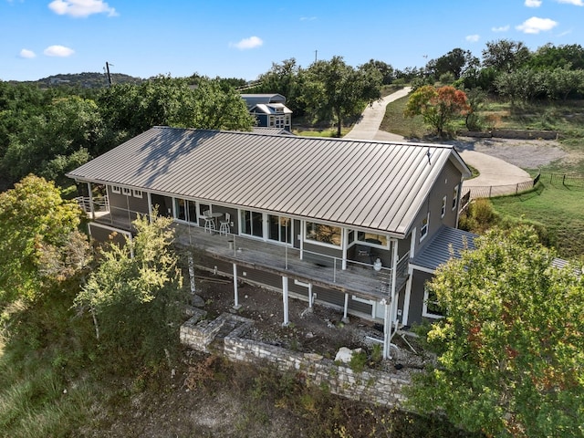 21200 Bertram Ln, Spicewood, TX 78669 - rear view of property featuring metal roof