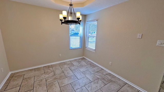 unfurnished dining area with a notable chandelier