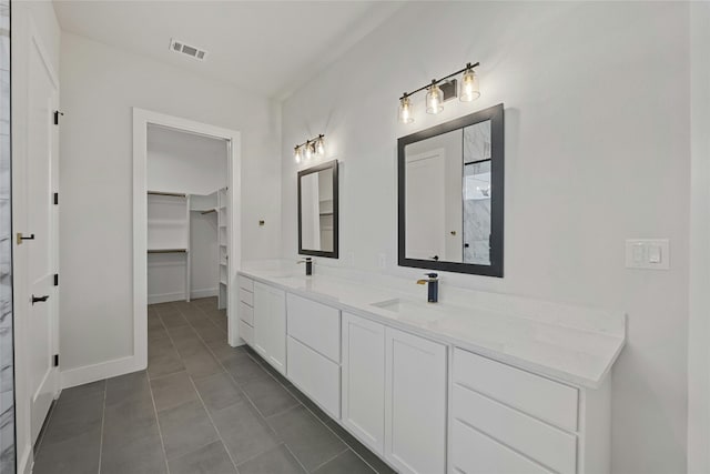 bathroom featuring tile patterned floors and vanity