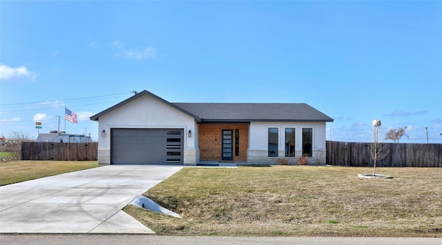 view of front facade featuring a front yard and a garage