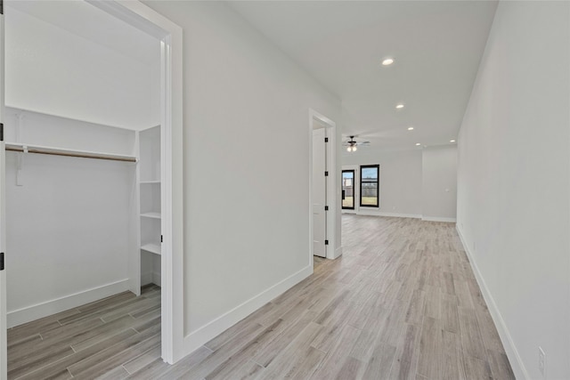 hallway with light wood-type flooring