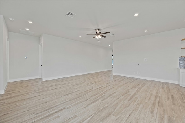 empty room featuring ceiling fan and light hardwood / wood-style flooring