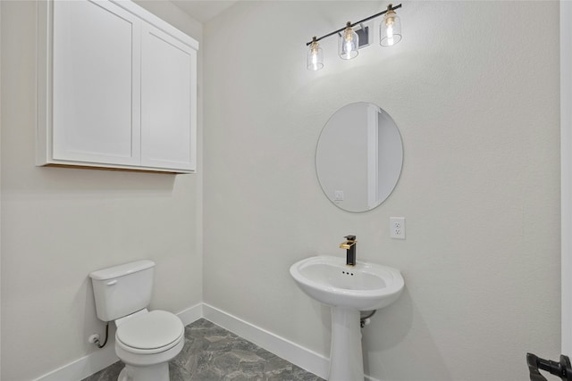 bathroom featuring tile patterned floors and toilet