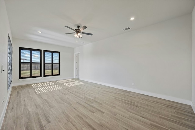 unfurnished room featuring ceiling fan and light wood-type flooring