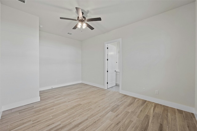 spare room with light hardwood / wood-style flooring and ceiling fan