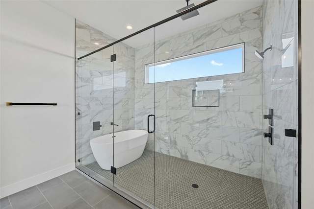 bathroom featuring tile patterned flooring and independent shower and bath