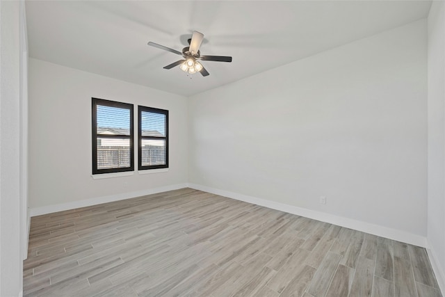 empty room with light hardwood / wood-style floors and ceiling fan