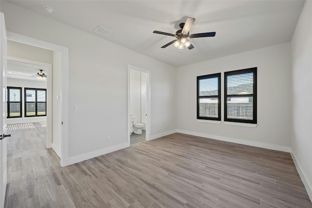 unfurnished room featuring light hardwood / wood-style floors, a wealth of natural light, and ceiling fan