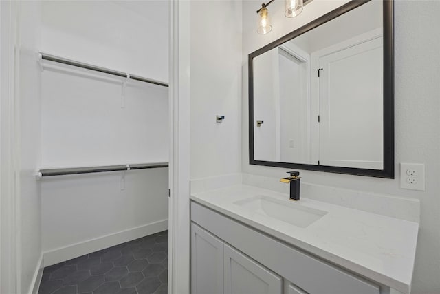 bathroom featuring tile patterned flooring and vanity