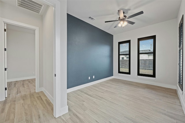 unfurnished room featuring light hardwood / wood-style floors and ceiling fan