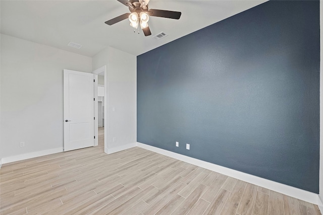 unfurnished room with ceiling fan and light hardwood / wood-style floors