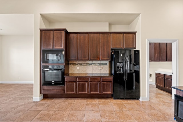 kitchen featuring light tile patterned floors, backsplash, dark brown cabinetry, and black appliances