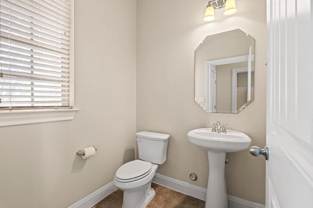 bathroom with sink, tile patterned flooring, and toilet