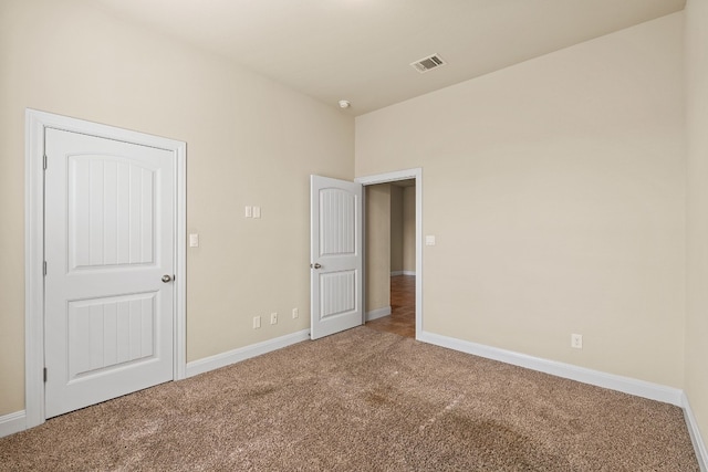 unfurnished bedroom featuring carpet flooring