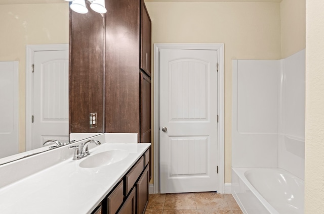 bathroom with tile patterned floors, vanity, and shower / tub combination