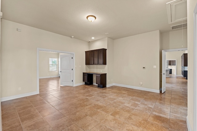 unfurnished living room with a textured ceiling