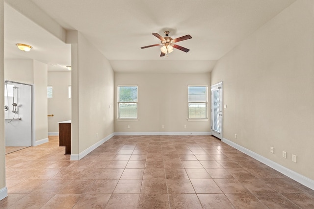 unfurnished room featuring ceiling fan and light tile patterned flooring