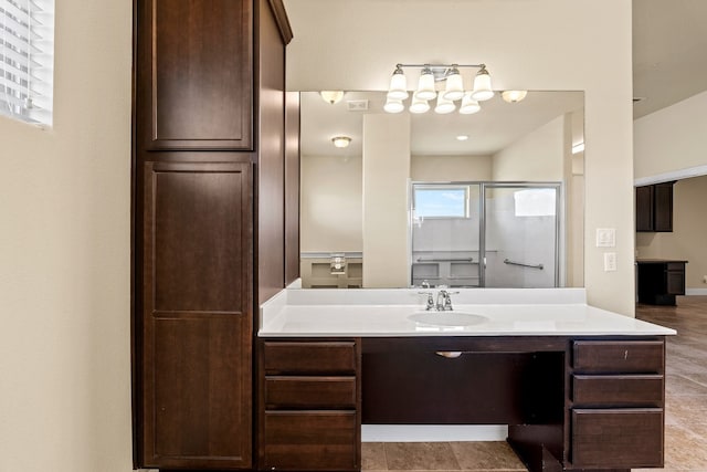 bathroom with vanity, tile patterned floors, and walk in shower