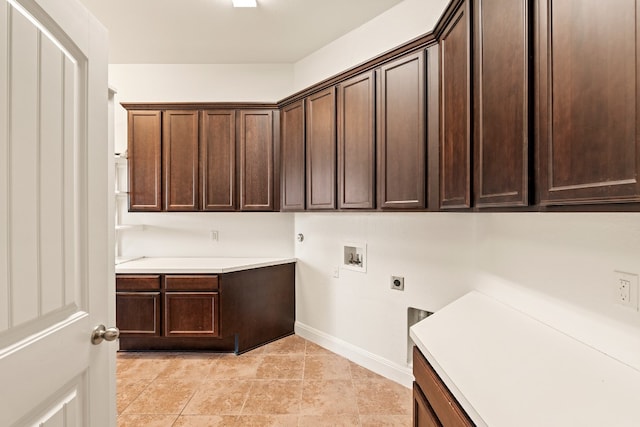 clothes washing area with hookup for a gas dryer, hookup for a washing machine, cabinets, and hookup for an electric dryer