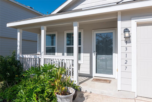 entrance to property featuring covered porch