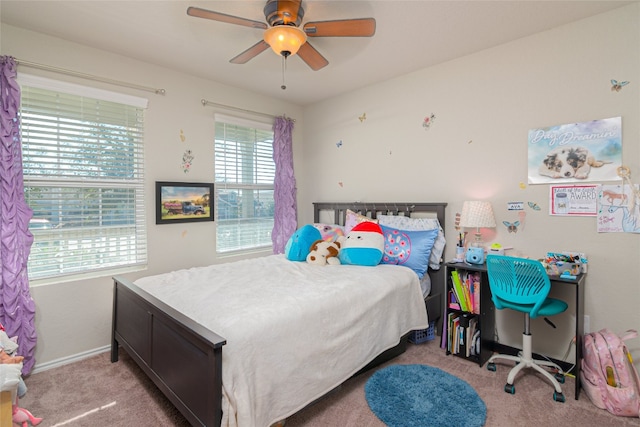 bedroom with ceiling fan and light carpet