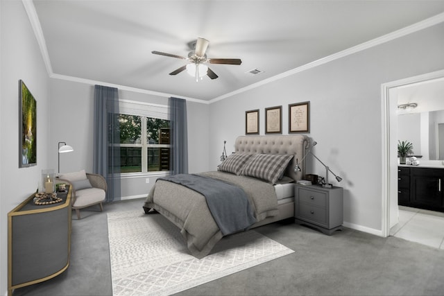 carpeted bedroom featuring connected bathroom, ceiling fan, and crown molding