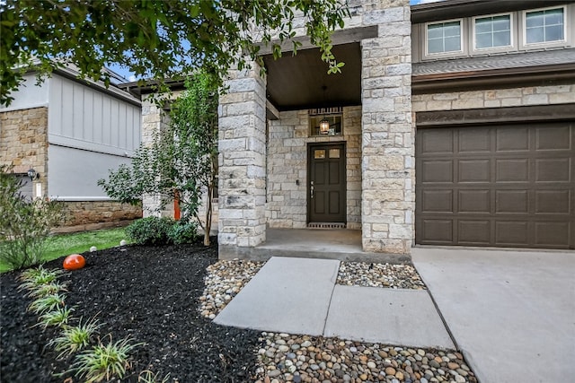 view of exterior entry with a garage