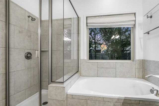 bathroom featuring plus walk in shower