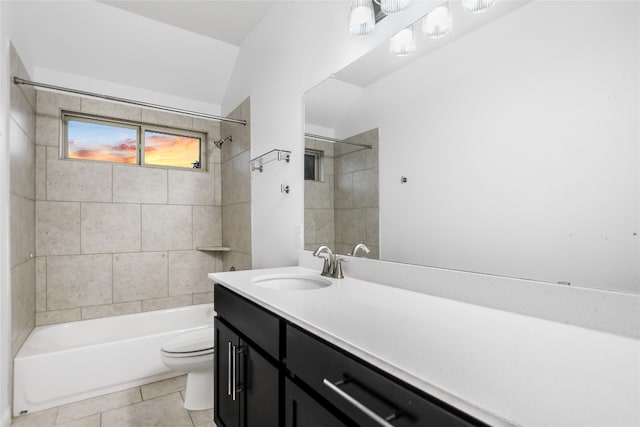 full bathroom with tile patterned flooring, vanity, toilet, and tiled shower / bath combo