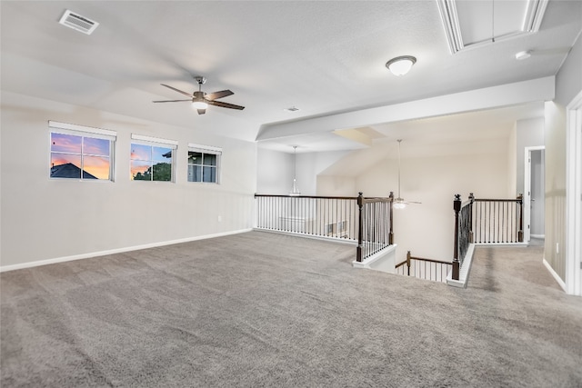 unfurnished room featuring carpet, ceiling fan, and lofted ceiling