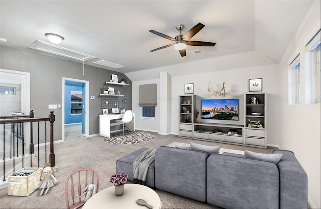 carpeted living room with ceiling fan