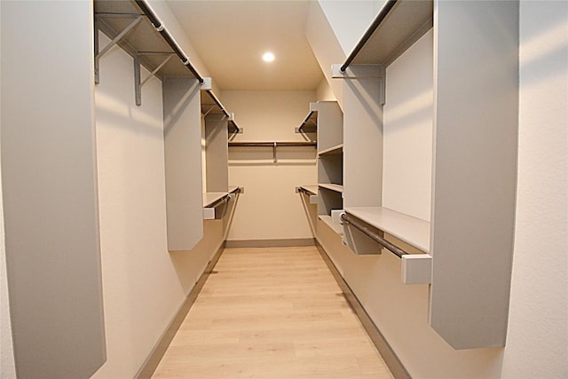 spacious closet featuring light hardwood / wood-style flooring