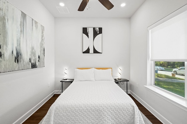 bedroom with ceiling fan and dark hardwood / wood-style floors