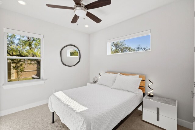 carpeted bedroom featuring ceiling fan