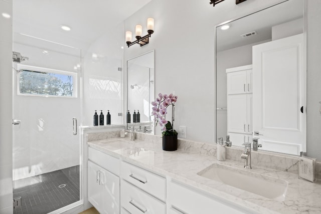 bathroom featuring vanity, tile patterned floors, and a shower with door