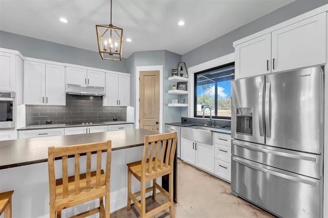 kitchen featuring white cabinetry, sink, and appliances with stainless steel finishes