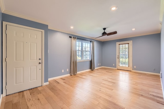 entryway with light wood-type flooring, ceiling fan, and ornamental molding