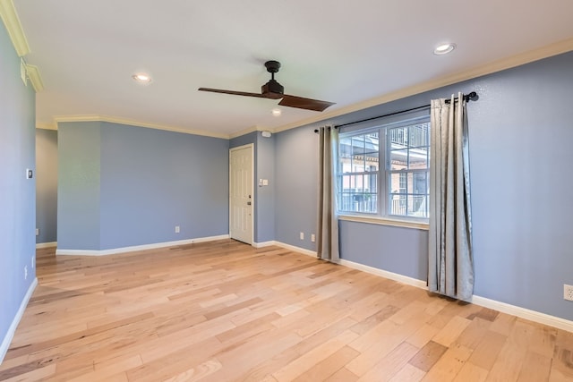 spare room featuring ceiling fan, light hardwood / wood-style floors, and ornamental molding