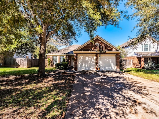 view of front of property featuring a garage and a front lawn