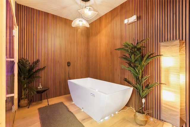 bathroom featuring wood walls