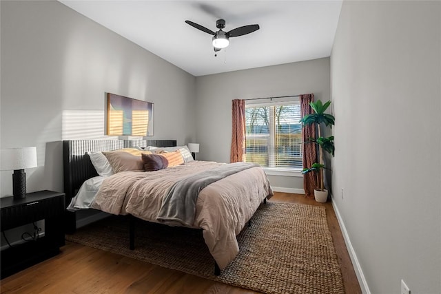 bedroom with hardwood / wood-style flooring and ceiling fan