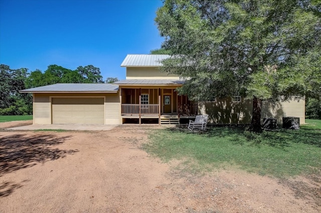 view of front of home with a porch and a garage