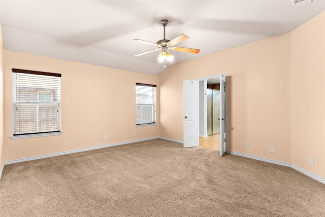 carpeted spare room with ceiling fan