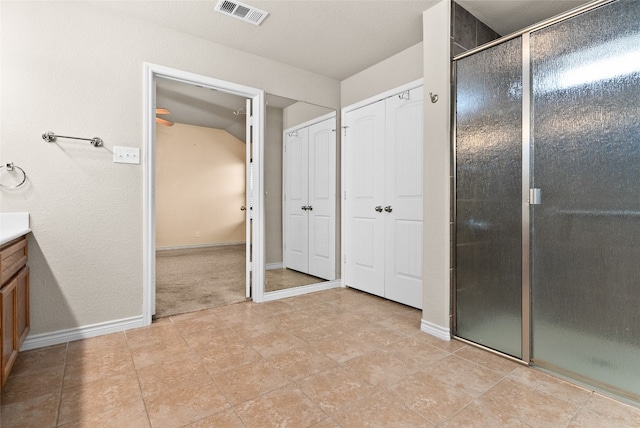 bathroom featuring vanity and walk in shower