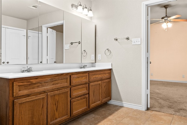 bathroom featuring ceiling fan and vanity