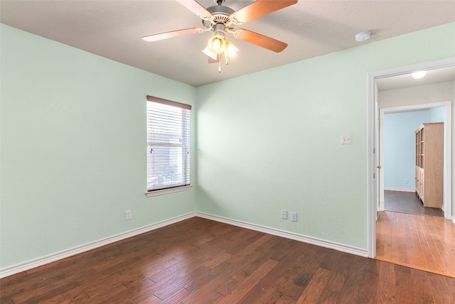 spare room with wood-type flooring and ceiling fan