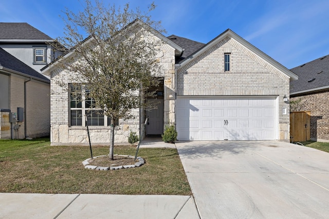 view of front of property featuring a front lawn and a garage