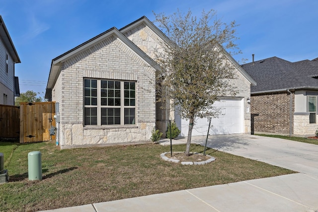 view of front of property featuring a front yard and a garage