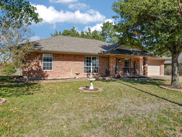 ranch-style house with a garage and a front lawn