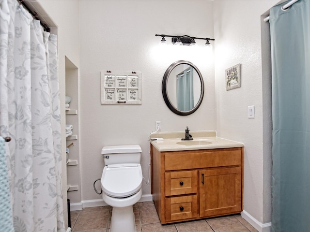 bathroom with tile patterned floors, a shower with curtain, vanity, and toilet